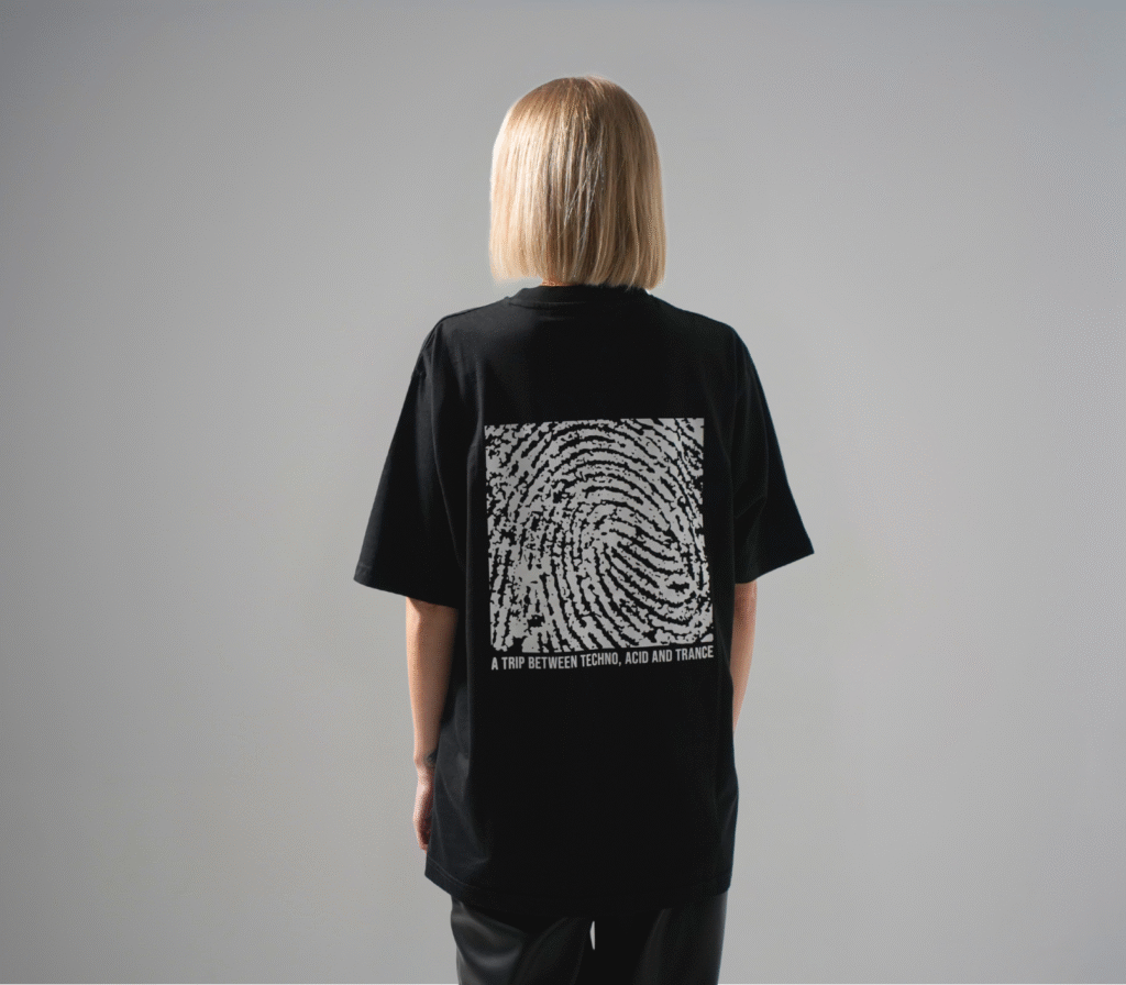 Rear view of model wearing the HELIX TEE001 featuring fingerprint artwork